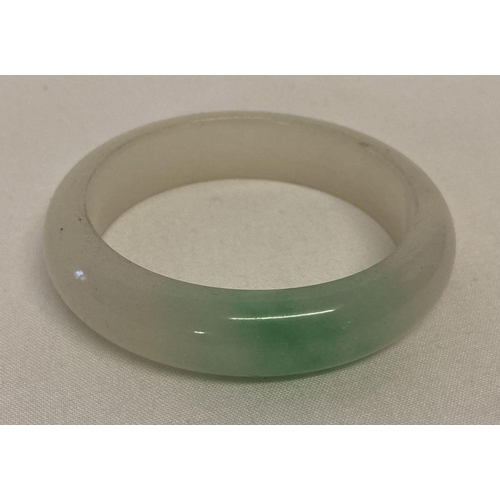 1019 - A chunky Chinese jade bangle with flat interior and rounded exterior.   Approx. 8cm diameter, with 6... 