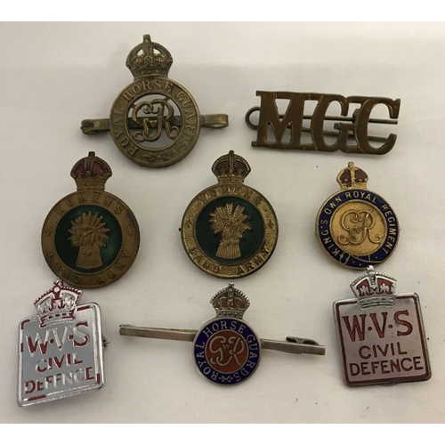 1 - A collection of vintage military badges to include Royal Horse Guards and Women's Land army. Lot inc... 