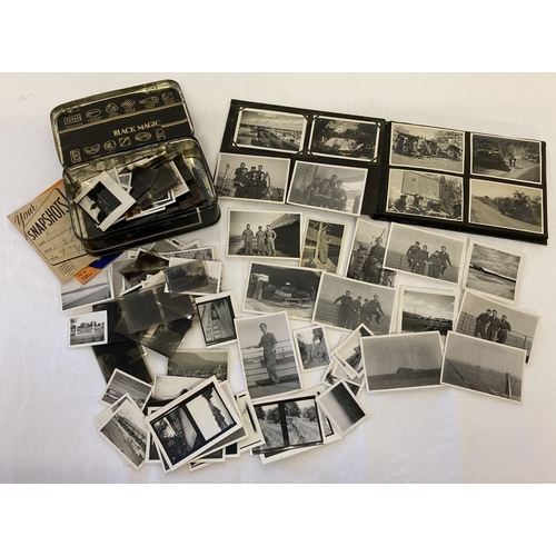 103 - A small vintage photo album containing photographs of military service in Egypt. Together with a loo... 