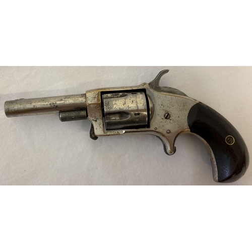 117 - An antique .32 calibre Blue Whistler rim fire revolver with wooden grip. No. 6 and other indistinct ... 