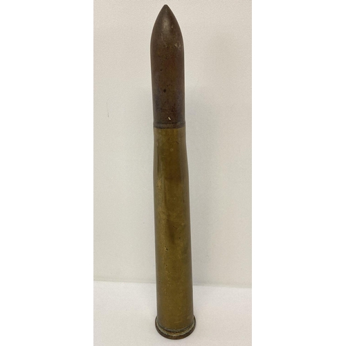 122 - A vintage 60mm brass artillery shell. No marking to base. Inert.  Total height approx. 44.5cm.