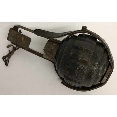 129 - A WWI style Imperial German Kugel grenade - Inert, in pannier. Metal framed pannier with leather str... 