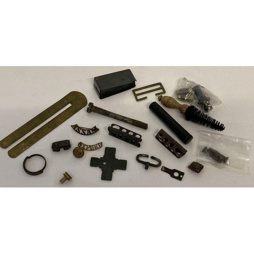 148 - A collection of mixed military items. Comprising: Lee Enfield No. 4 top ring guard, oil bottle, stoc... 