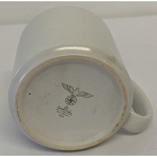154 - A WWII style German army white ceramic mug with printed markings to underside.  Approx. 9cm tall x 9... 