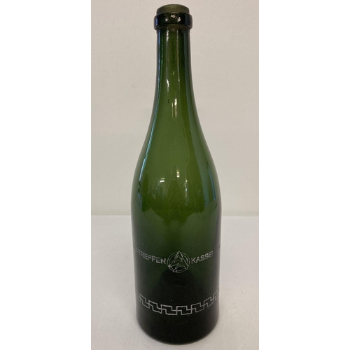 170 - A green glass wine bottle with German WWII style engraved detail.  Approx. 30cm tall.