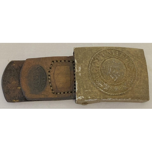 172 - A German WWII style Africa Corps belt buckle with leather tab.