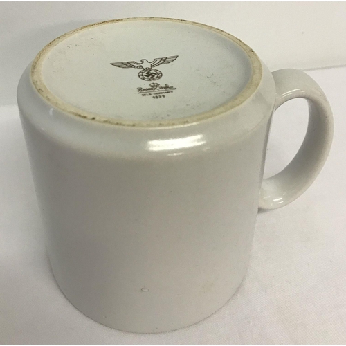 193 - A WWII style German Army white ceramic mug. Printed to underside with Rosenthal makers mark, Nazi ea... 