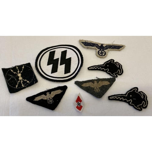 218 - A small collection of German WWII style embroidered cloth badges.