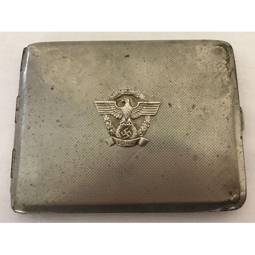 221 - A German WWII style cigarette case with Nazi eagle & swastika logo and dated 1942. Complete with int... 