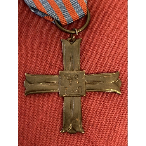 252 - A post war Monte Cassino Medal Of Honour on blue and red ribbon.  Measures 40mm across.