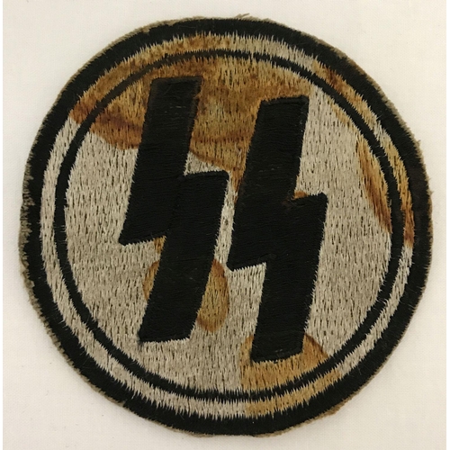 31 - A German WWII style late war ersatz SS circular embroidered PT vest patch.  Approx. 8.5cm diameter.