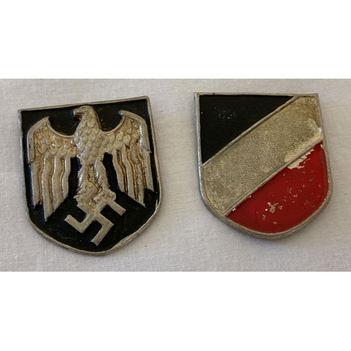 33 - 2 German WWII style Africa Corps tropical helmet badges. Each badge has 3 fixings to reverse. Each a... 