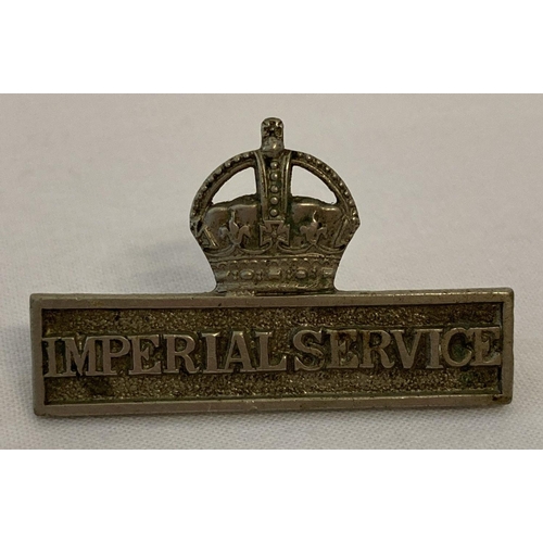 49 - A WWI Territorial Imperial Service badge. Clip fastening on reverse needs attention. Approx. 4.25cm ... 