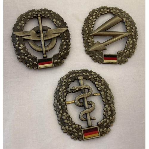 51 - 3 modern BRD German army beret badges. Logistics QM troops, Medical troops and Signal Corps.