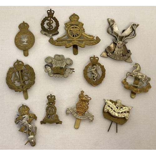55 - A collection of 12 assorted vintage cap badges with slider and lug fixings.