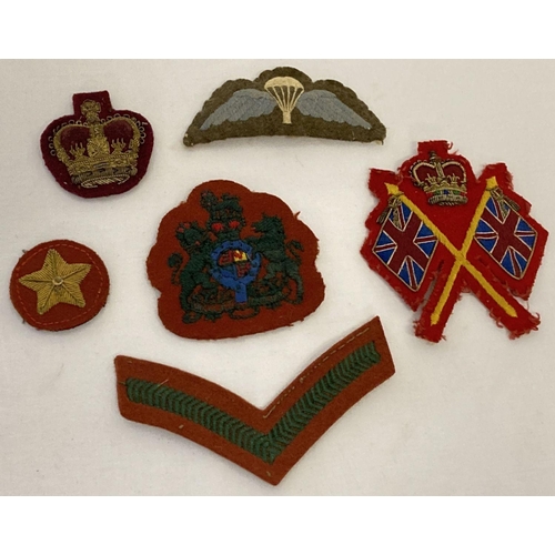 57 - 6 vintage military embroidered cloth badges to include bullion examples.