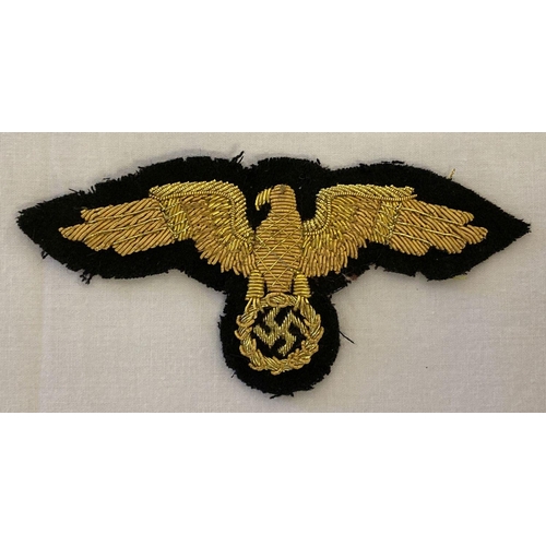 58 - A reproduction WWII style German diplomatic officials gold bullion cap eagle cloth badge.  Approx 5.... 