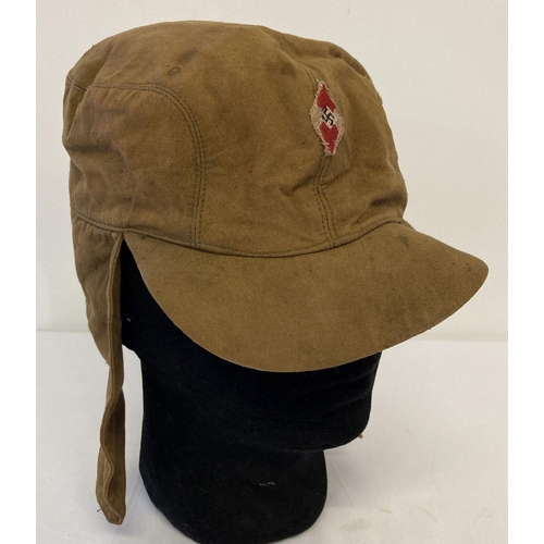 62 - A German WWII style Hitler Youth Cold weather canvas cap with embroidered diamond HJ badge to front.... 