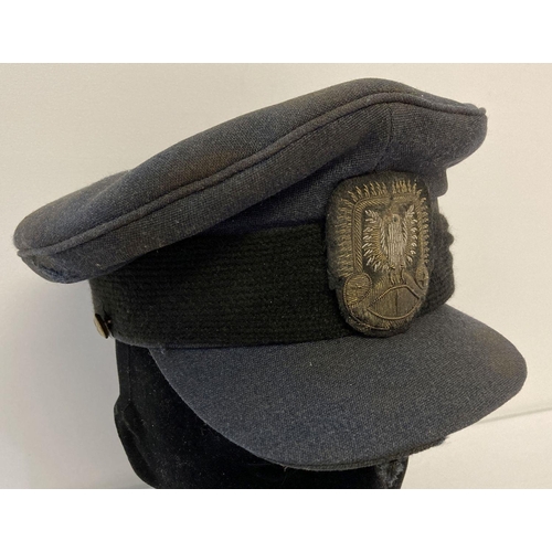 68 - A vintage RAF peaked cap with WWII style Polish Air Force Officers bullion cap badge. Hat is a littl... 