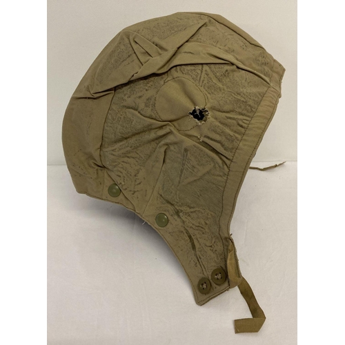 72 - A 1954 military issue tank crew canvas helmet cover, Size 3, by Cookson & Clegg Ltd.