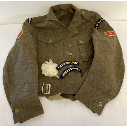 81 - A 1960 British Army jacket with Sussex Yeomanry badges to arms and shoulders. Together with 2 cloth ... 