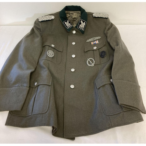 91 - A replica WWII German SS officers Obergrupenfuhrer tunic with epaulettes and badges.  Size Large.