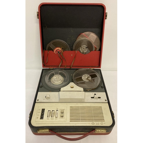A vintage GEC reel to reel tape recorder machine in black and red portable  carry case.
