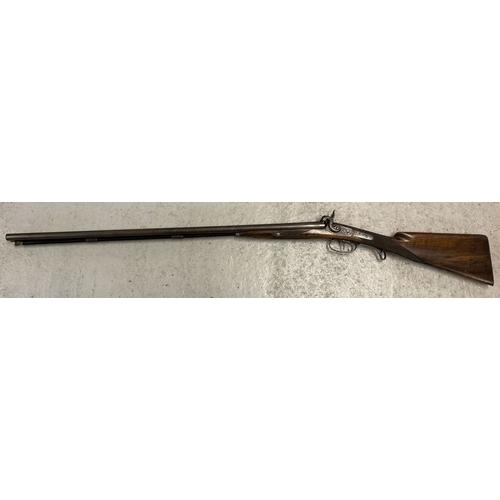 110 - An Antique double barrelled 16 bore percussion shotgun, with rod and wad removal screw. 32in Damascu... 
