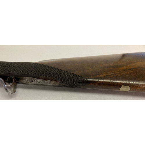 110 - An Antique double barrelled 16 bore percussion shotgun, with rod and wad removal screw. 32in Damascu... 