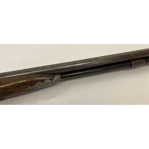 110 - An Antique double barrelled 16 bore percussion shotgun, with rod and wad removal screw. 32in Damascu... 
