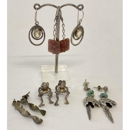 33 - 5 pairs of silver and white metal earrings, all in a drop style. To include stone set and frogs.