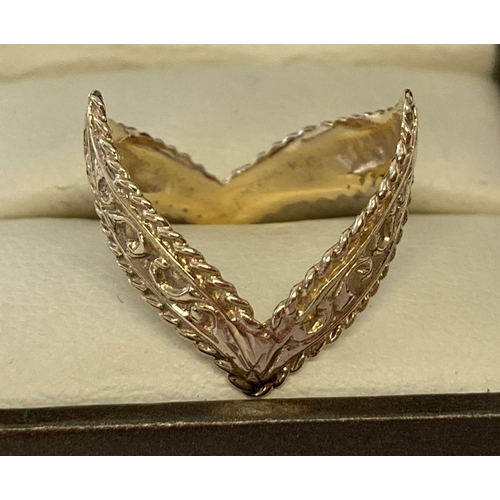 58 - A 9ct gold double wishbone dress ring with scroll decoration throughout. Hallmarks to inside. Size M... 