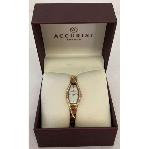 1002 - A boxed ladies wristwatch by Accurist. Gold tone bracelet with crystal detail to case. Mother of pea... 