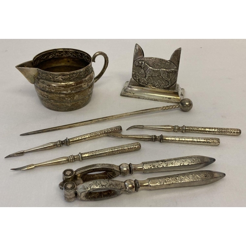 1012 - A small quantity of assorted vintage silver plated & pewter items to include nutcrackers. Lot also i... 