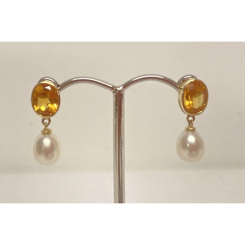 1002 - A Pair of 9ct gold, citrine and pearl drop style earrings. Round cut bezel set citrines with a oval ... 