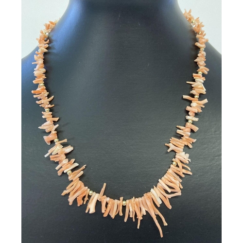 1010 - A vintage 18 inch branch coral necklace with spring style clasp.