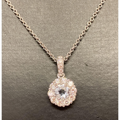 1033 - A 18ct white gold aquamarine and diamond pendant necklace by Luke Stockley London. Circular pendant ... 
