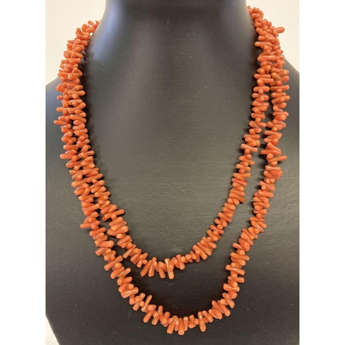 1038 - A vintage 40 inch branch coral necklace with push barrel clasp.