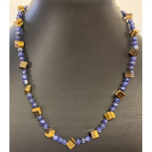 1078 - A lapis lazuli and square shaped tigers eye beaded necklace with flower shaped T bar clasp.  Approx.... 