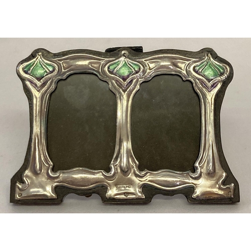 1110 - A small Art Nouveau style freestanding double picture frame with enamelled detail. Marked 