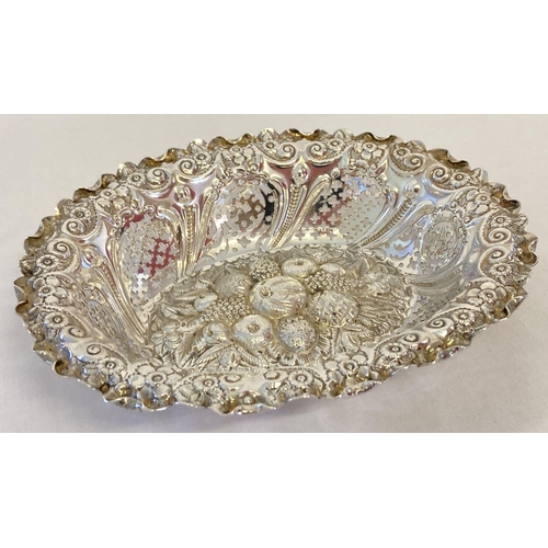 1127 - A Victorian highly decorative silver bon bon dish with pierced work, fruit and floral detail. Hallma... 