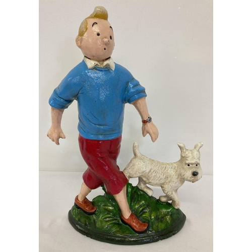 1141 - A painted cast iron flat backed door stop, in the shape of Tin Tin and Snowy.  Approx. 28cm tall.