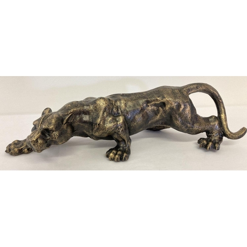 1143 - A heavy bronzed effect cast metal figurine of a stalking panther  Approx. 42cm long.