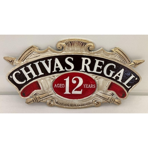 1147 - A Chivas Regal Scotch whisky painted cast metal wall hanging plaque. In gold, black, white and red a... 