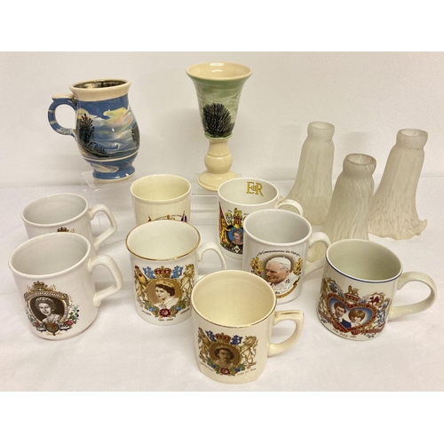1173 - A box of assorted ceramics & glass to include studio pottery and commemorative mugs.