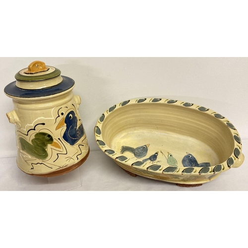 1180 - 2 pieces of modern studio pottery with yellow glaze and hand painted bird detail. A lidded storage j... 