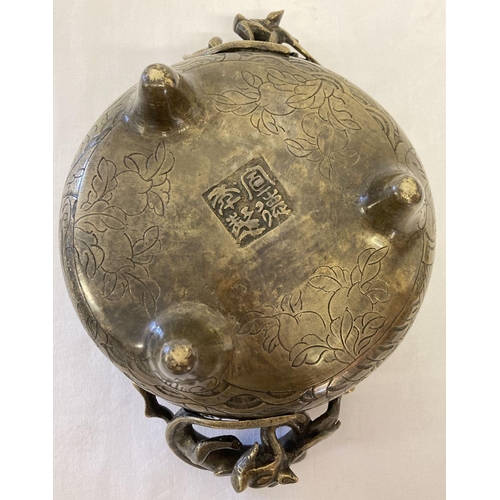 1197 - A large vintage Chinese 2 handled censer with decorative dragon shaped handles. Raised on tripod fee... 