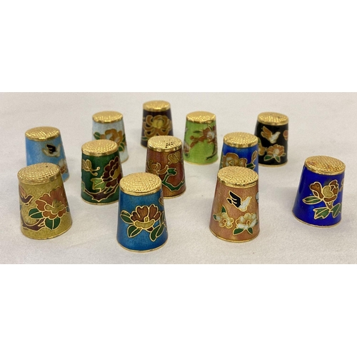 1261 - A collection of 12 assorted enamelled thimbles with floral detail.  Each approx. 2.5cm tall.