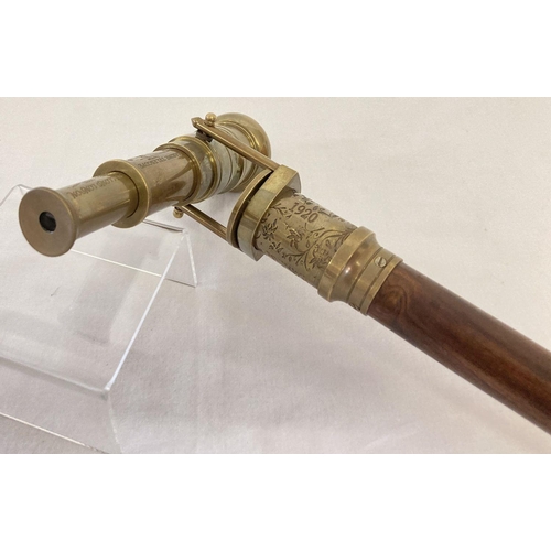 1263 - A reproduction wood and  brass walking stick with swivel top telescope/compass handle.  Approx. 95.5... 