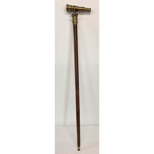 1263 - A reproduction wood and  brass walking stick with swivel top telescope/compass handle.  Approx. 95.5... 